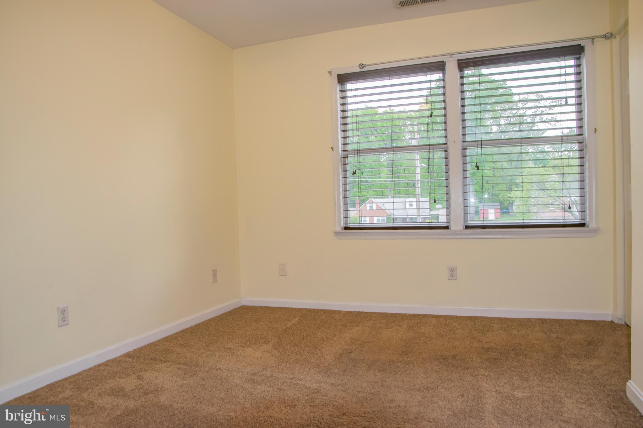1403 Spring Avenue Baltimore, MD 21237 - Photo 16 of 28 an empty room with a window