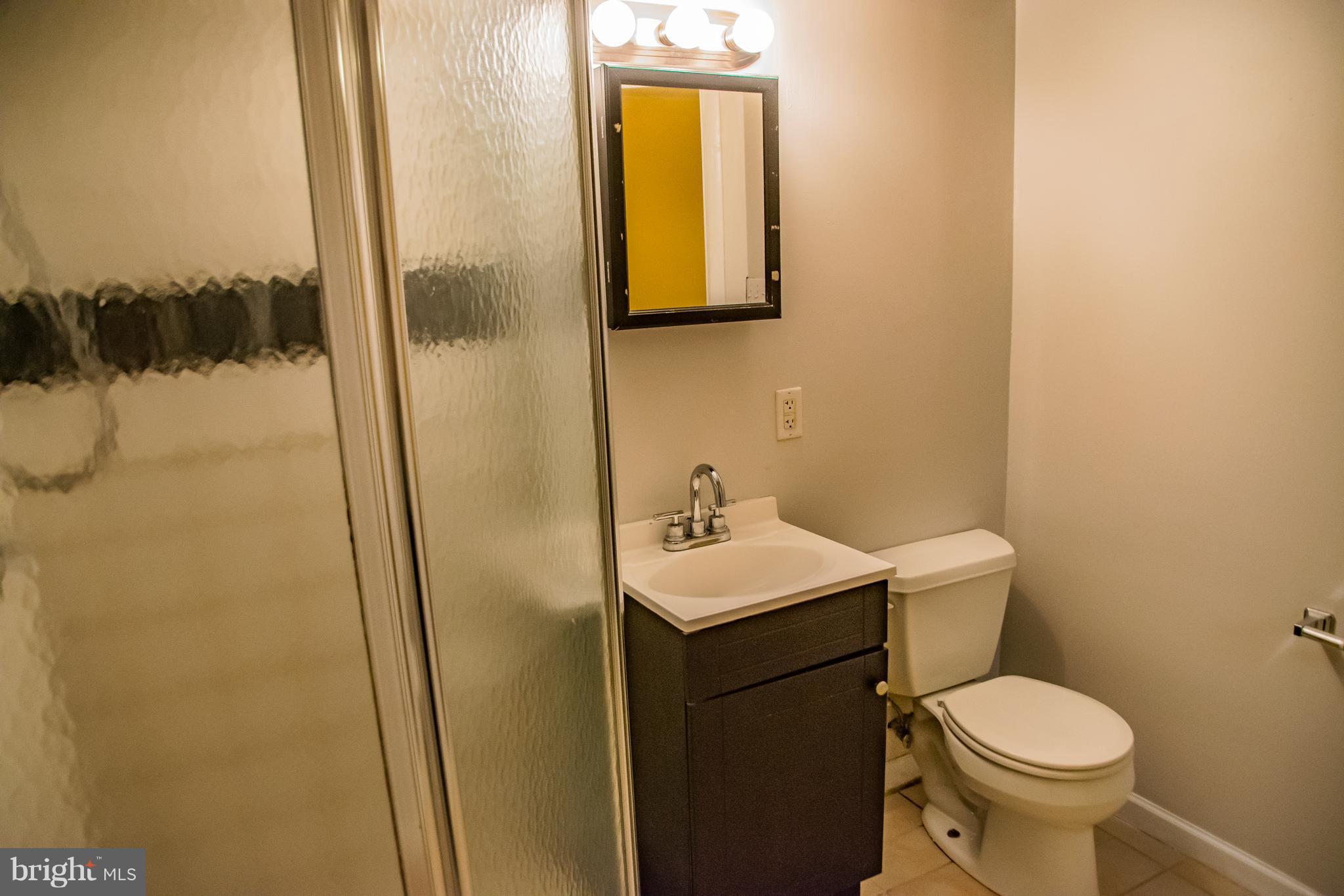 1403 Spring Avenue Baltimore, MD 21237 - Photo 23 of 28 a bathroom with a sink and a toilet