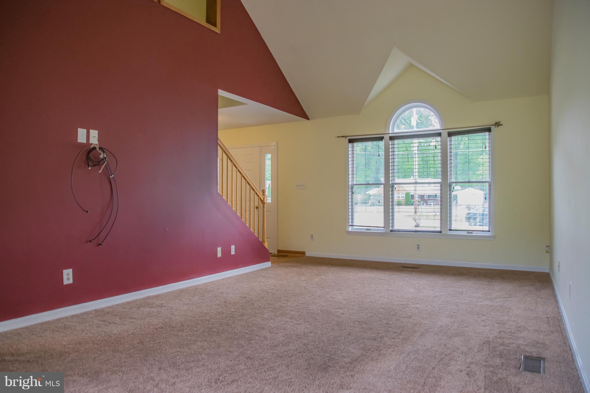 1403 Spring Avenue Baltimore, MD 21237 - Photo 4 of 28 an empty room with windows