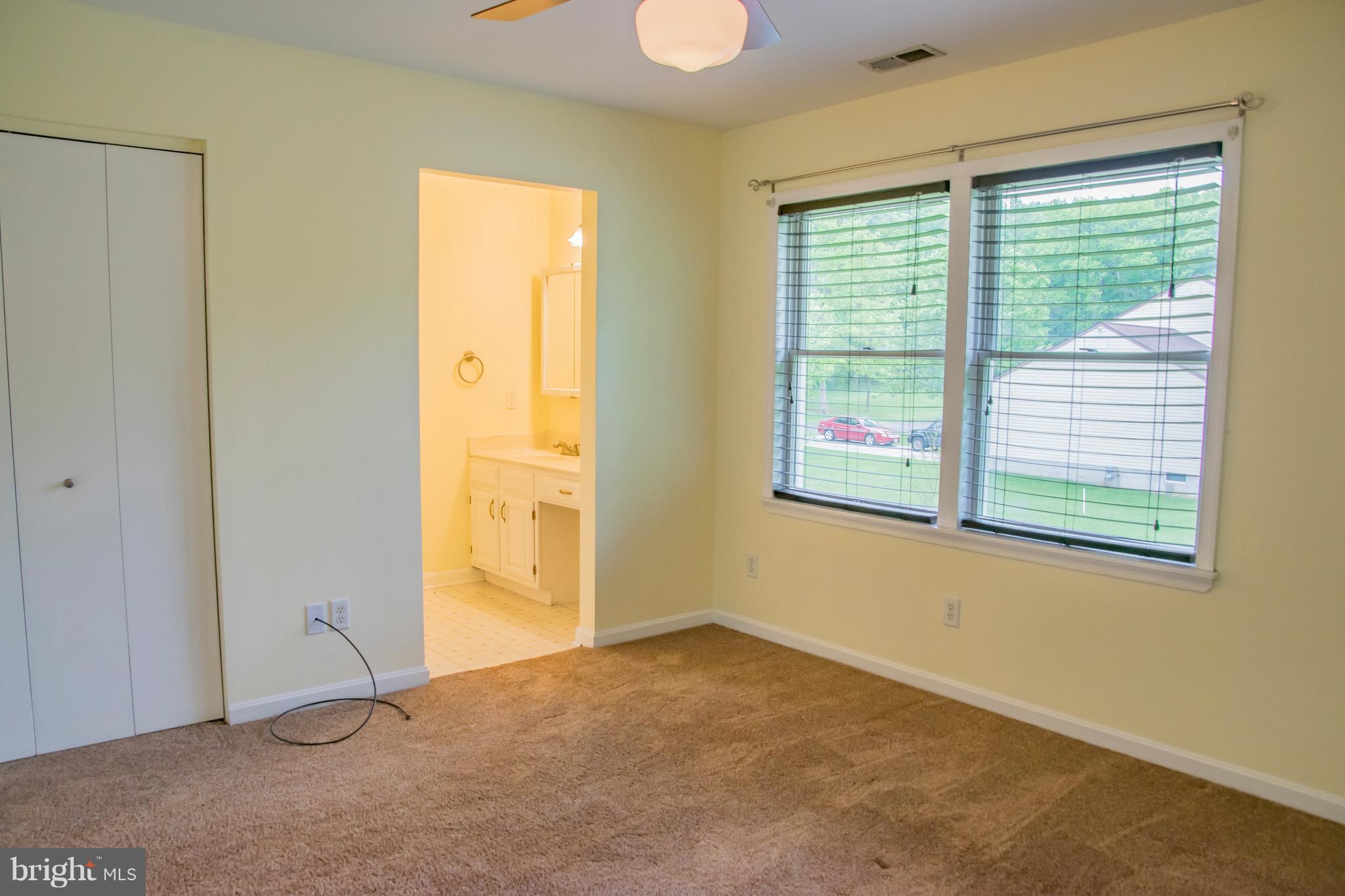 1403 Spring Avenue Baltimore, MD 21237 - Photo 9 of 28 a view of an empty room with a window