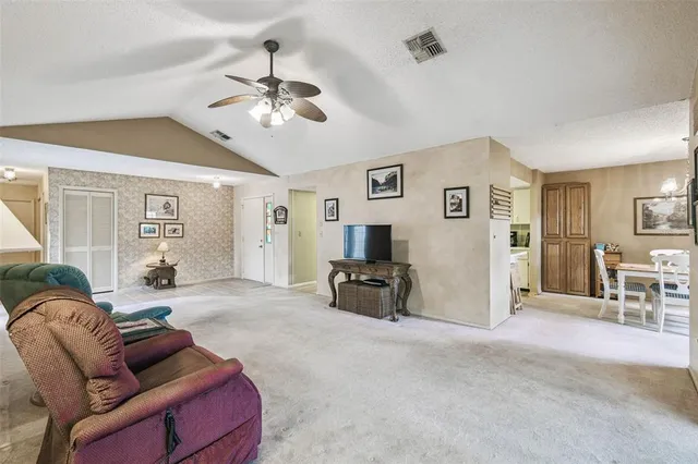 a kitchen with stove cabinets and refrigerator