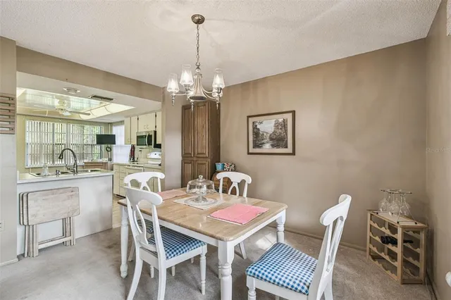 a bed room with a bed and a chandelier