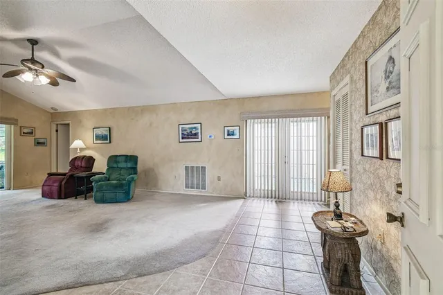 a room with furniture and a large window