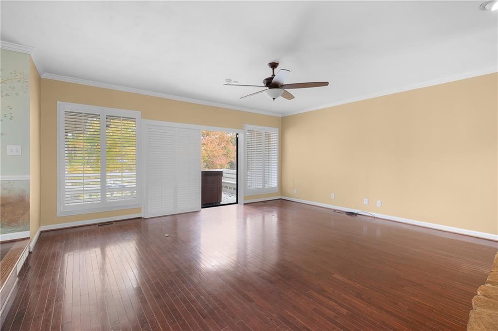 127 Windsor Drive Calhoun, GA 30701 - Photo 13 of 57 a view of an empty room with wooden floor and a window