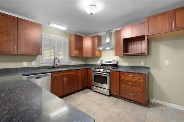a kitchen with a sink and wooden cabinets