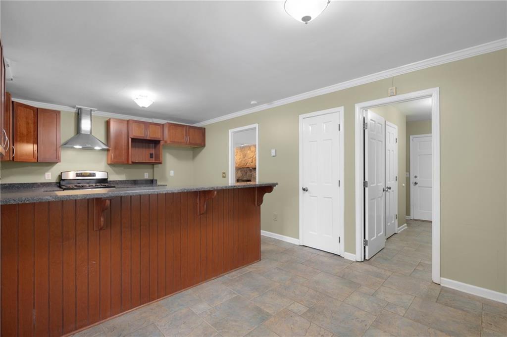 127 Windsor Drive Calhoun, GA 30701 - Photo 18 of 57 a kitchen with stainless steel appliances granite countertop a refrigerator and a stove top oven