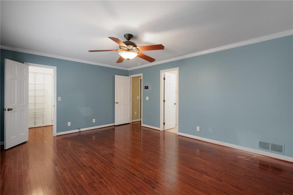 127 Windsor Drive Calhoun, GA 30701 - Photo 21 of 57 a view of an empty room with window and wooden floor