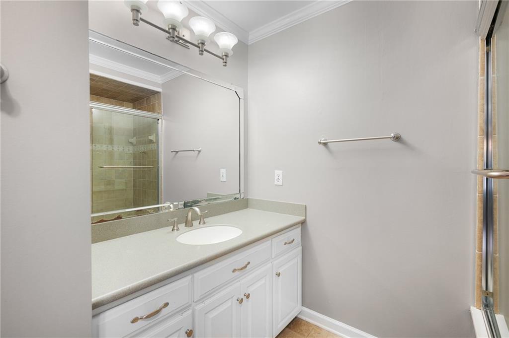 127 Windsor Drive Calhoun, GA 30701 - Photo 27 of 57 a bathroom with a sink vanity granite and a mirror
