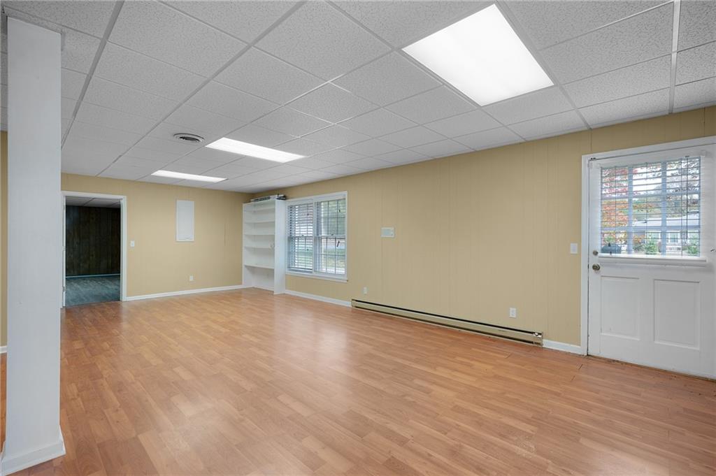 127 Windsor Drive Calhoun, GA 30701 - Photo 31 of 57 an empty room with wooden floor and windows