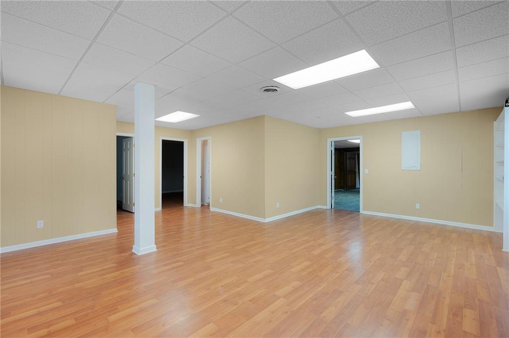 127 Windsor Drive Calhoun, GA 30701 - Photo 32 of 57 a view of an empty room with wooden floor