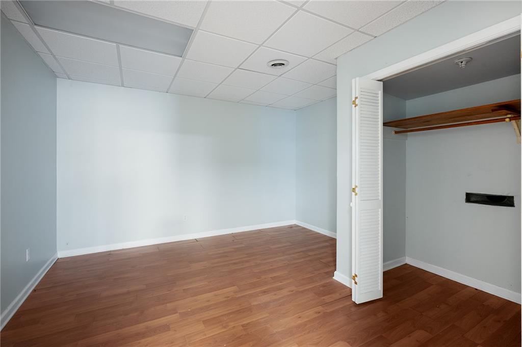 127 Windsor Drive Calhoun, GA 30701 - Photo 34 of 57 a view of an empty room with wooden floor