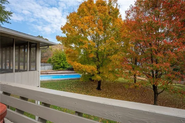 a view of a swimming pool with a patio