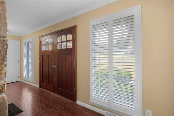 a view of hallway with wooden floor