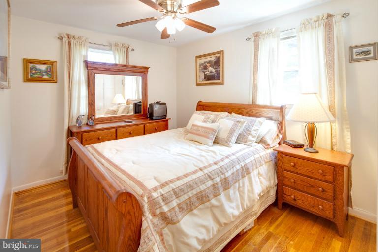 1914 Suffolk Road Finksburg, MD 21048 - Photo 16 of 30 a bedroom with a bed and a chandelier
