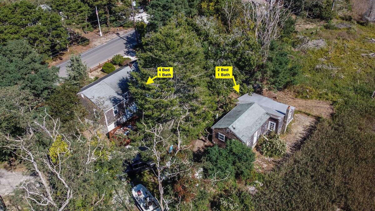 an aerial view of a house with a yard