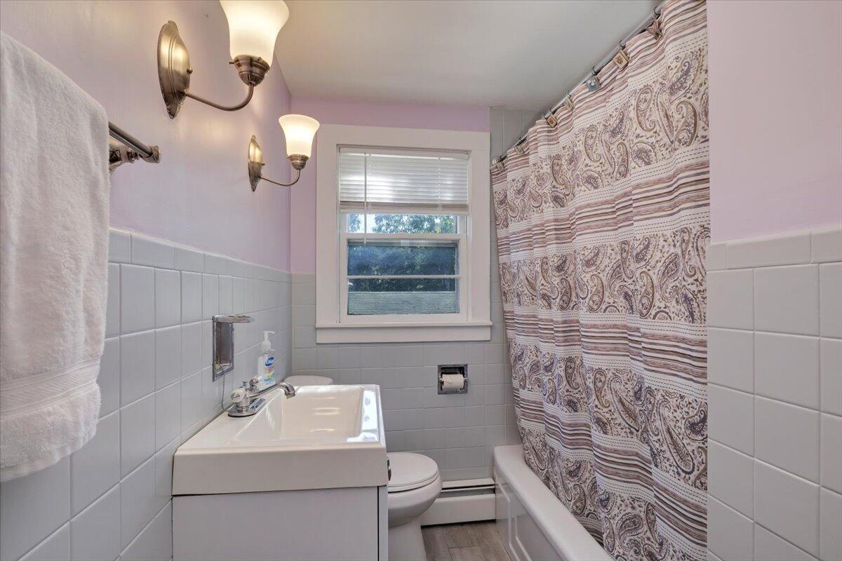 5 Indian Neck Road Wellfleet, MA 02667 - Photo 15 of 24 a bathroom with a sink toilet and shower