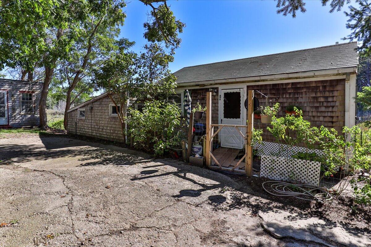 5 Indian Neck Road Wellfleet, MA 02667 - Photo 7 of 24 a view of a house with a yard
