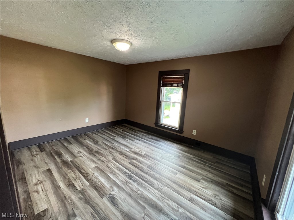 710 Cherry Road Northeast Massillon, OH 44646 - Photo 12 of 13 spare room featuring a textured ceiling