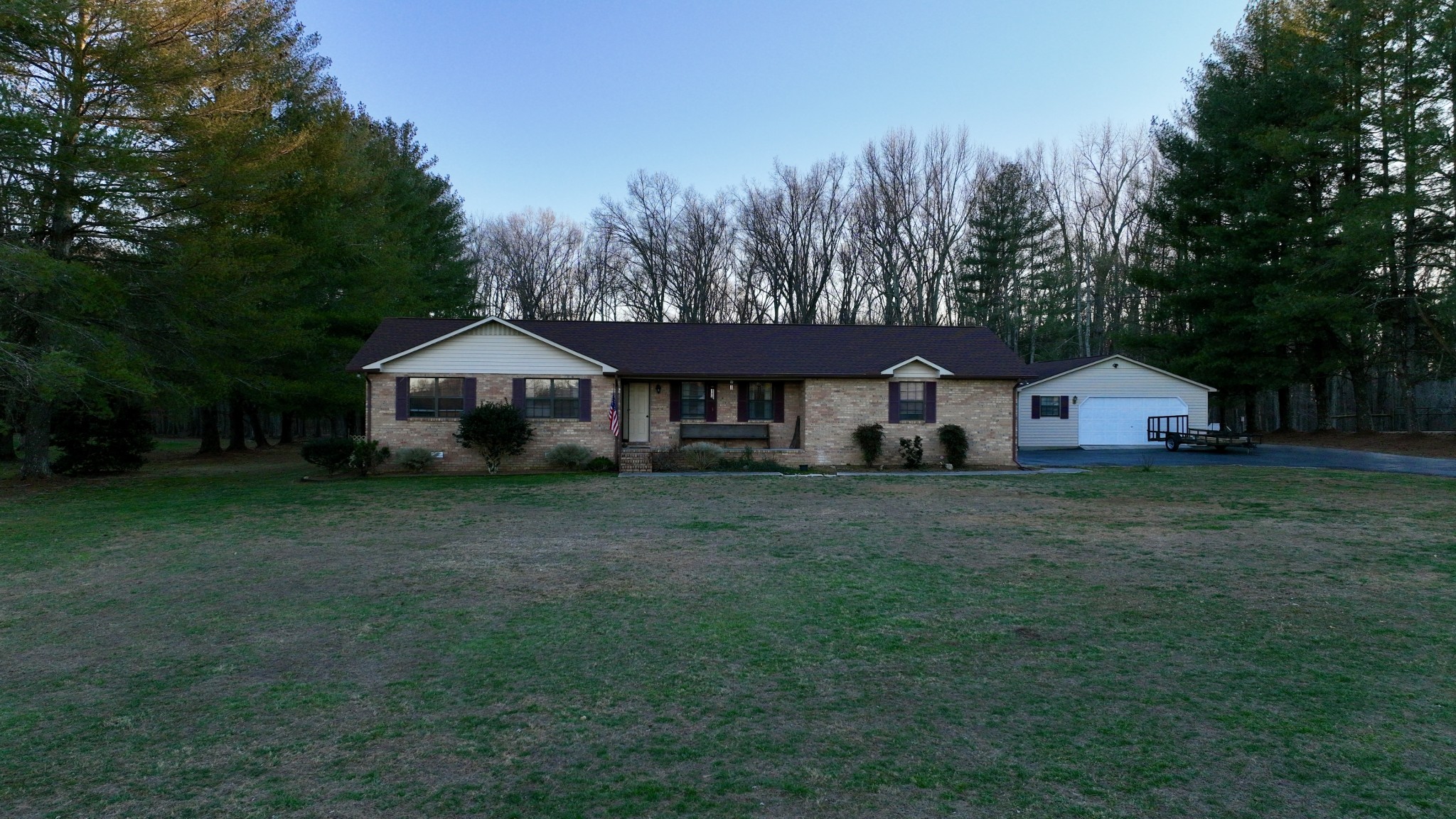510 Brandon Road Manchester, TN 37355 - Photo 12 of 50 a front view of a house with a yard and trees