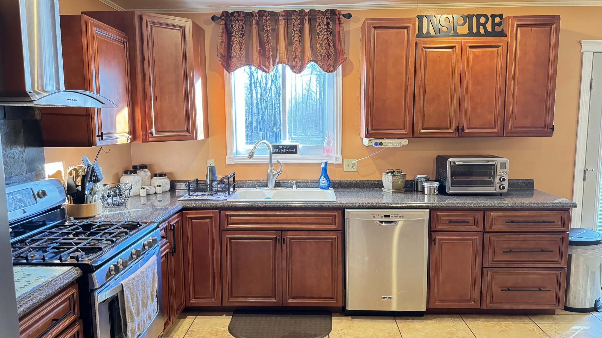 510 Brandon Road Manchester, TN 37355 - Photo 33 of 50 a kitchen with stainless steel appliances granite countertop a stove a sink and a microwave