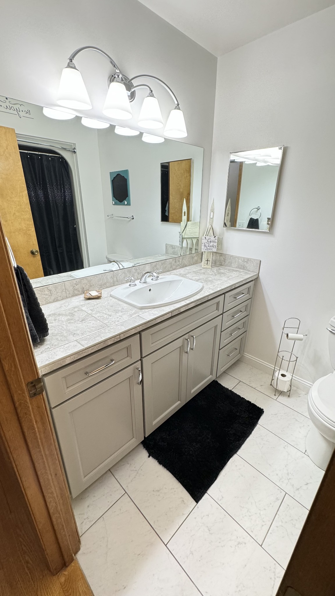 510 Brandon Road Manchester, TN 37355 - Photo 39 of 50 a bathroom with a sink a large mirror and a toilet
