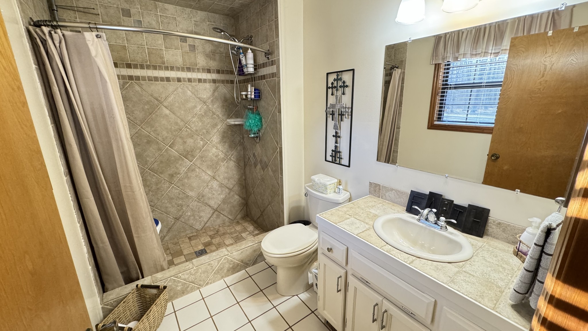 510 Brandon Road Manchester, TN 37355 - Photo 48 of 50 a bathroom with a sink toilet a mirror and shower
