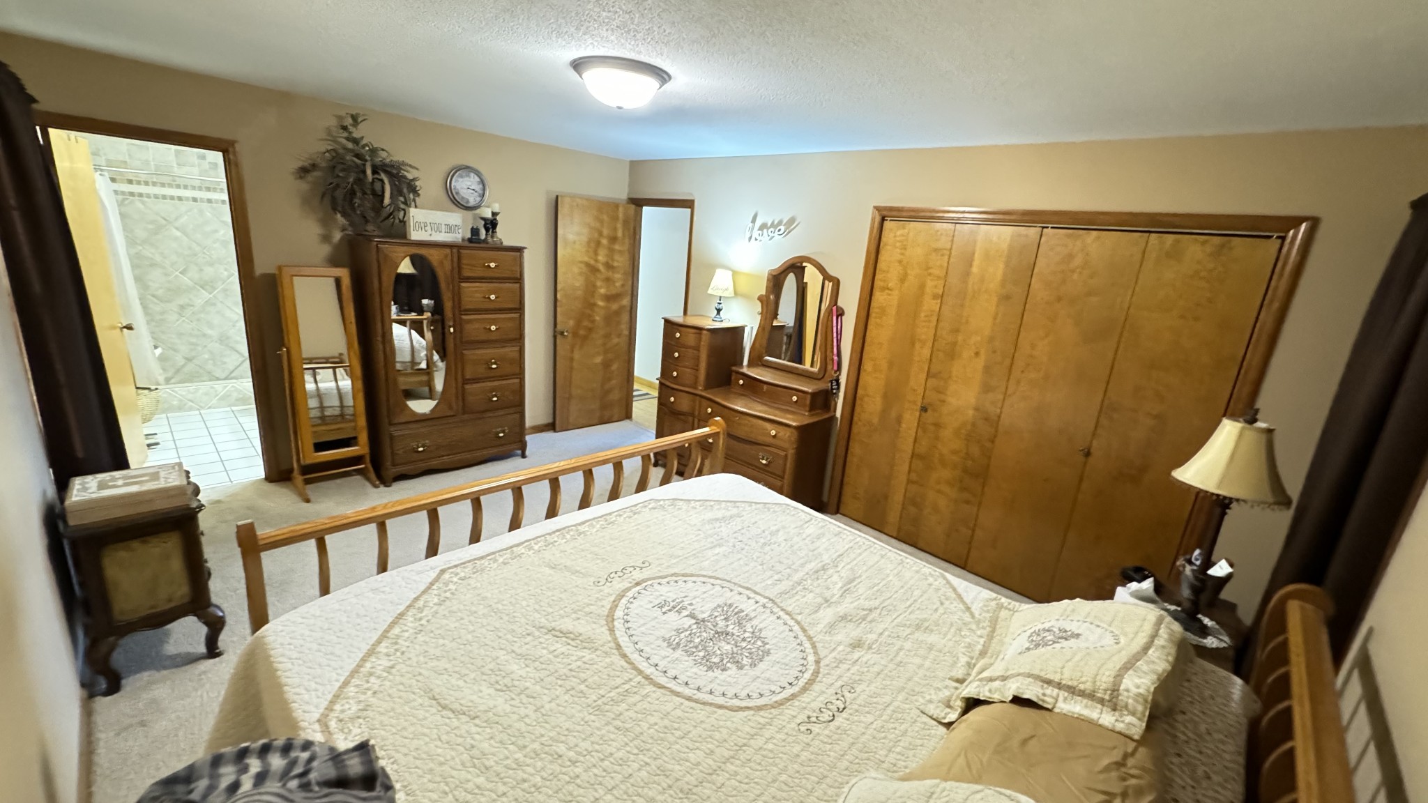 510 Brandon Road Manchester, TN 37355 - Photo 49 of 50 a bedroom with a bed a dresser and a mirror