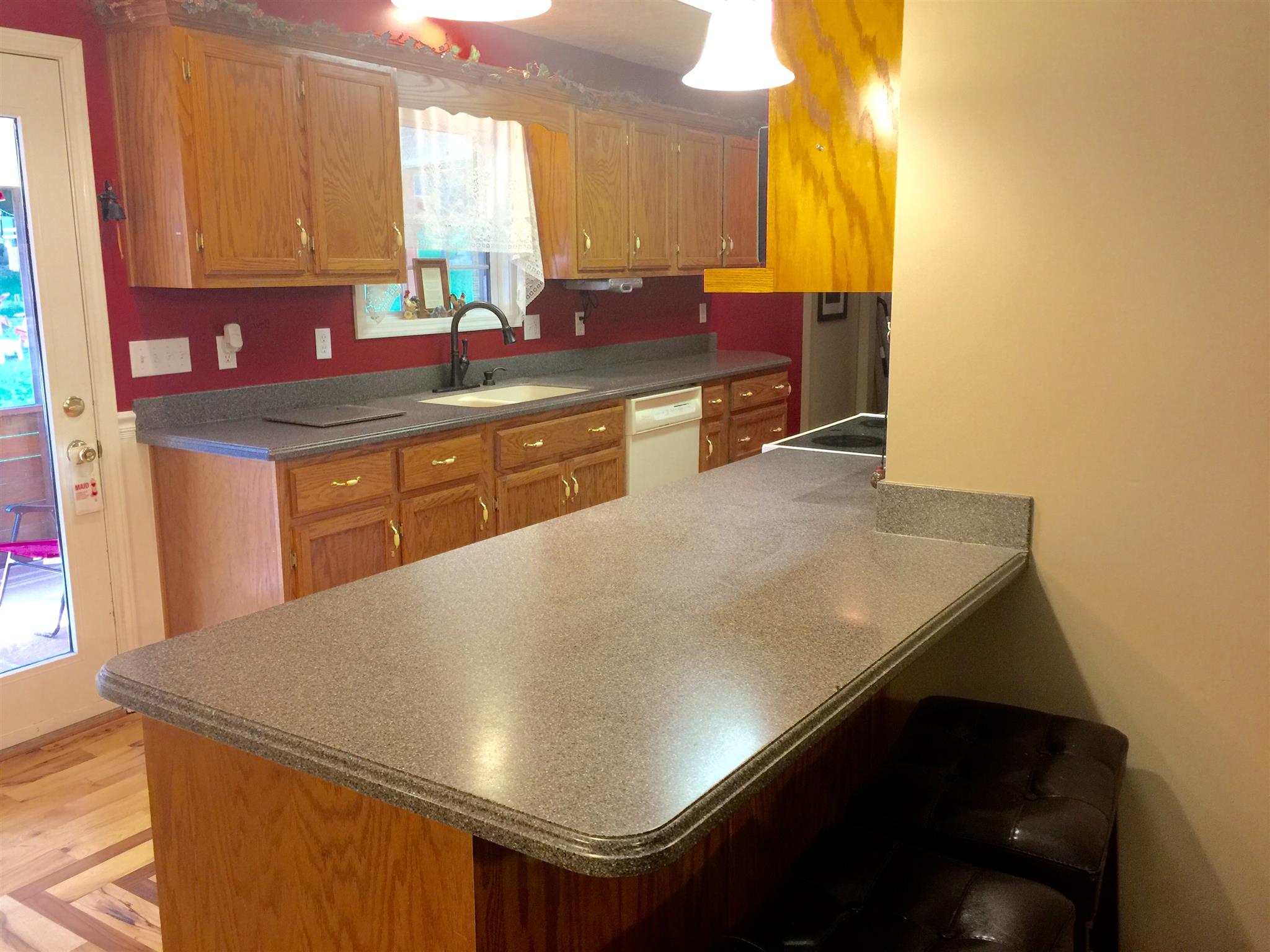 6762 New Chapel Road Springfield, TN 37172 - Photo 11 of 30 a kitchen with a sink a counter top space and cabinets