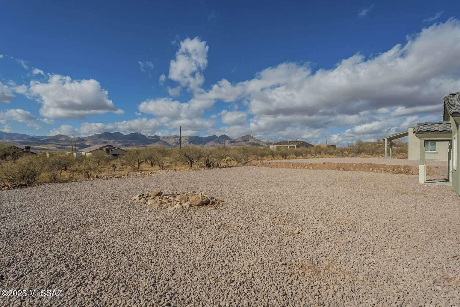 1796 Cajeme Court Rio Rico, AZ 85648 - Photo 31 of 45 a view of a lake with a big yard