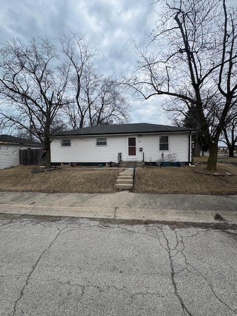 a house that has a tree in front of it