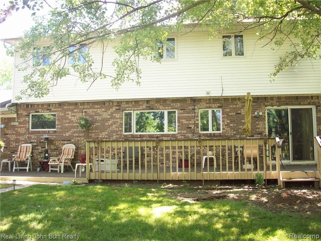60355 Mt Vernon Road Rochester, MI 48306 - Photo 20 of 21 View of cedar deck that runs the length of the back of the house