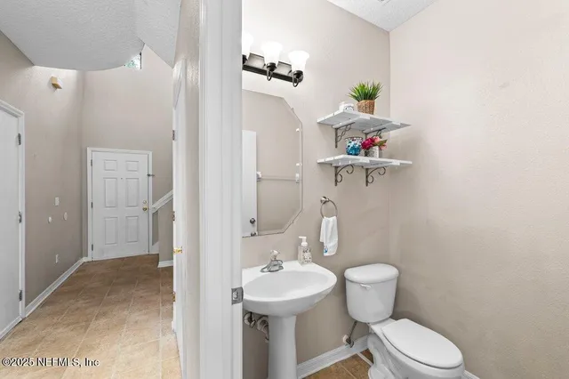 a view of entryway with stairs and wooden floor