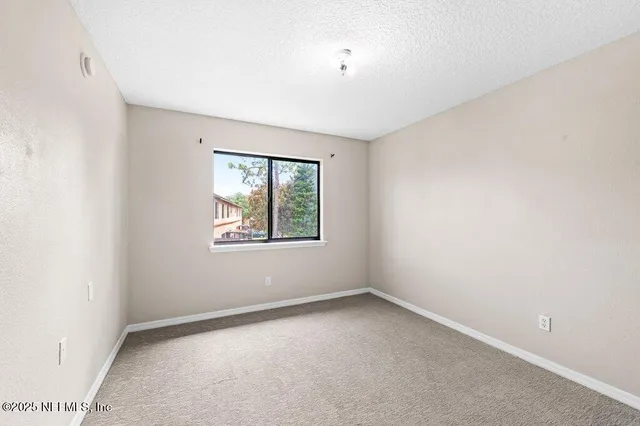 a view of hallway with washer and dryer
