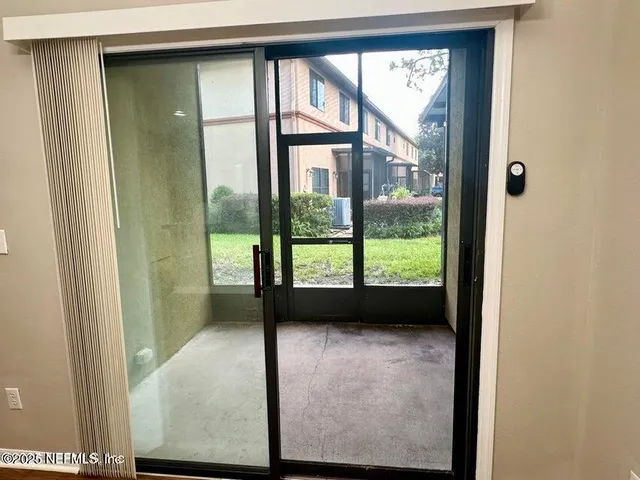 a view of a house with a yard porch and sitting area