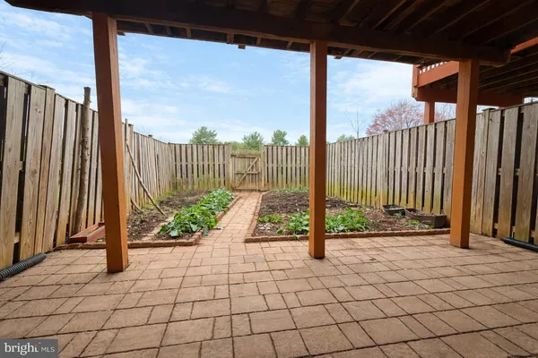 a view of a street with wooden fence