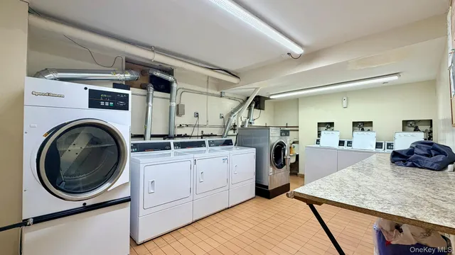 a kitchen with a sink a stove and cabinets