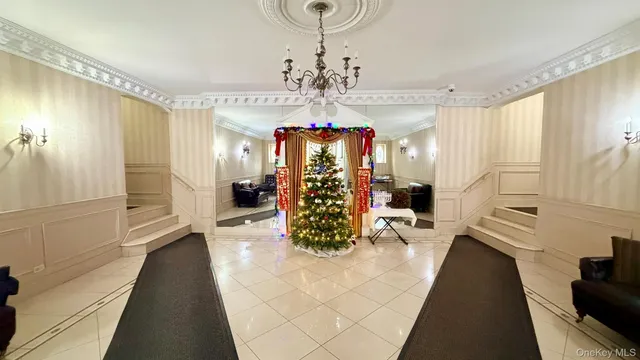 a view of a hallway with a chandelier