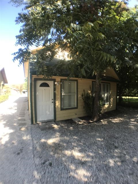 5603 Joe Sayers Avenue, Unit B Austin, TX 78756 - Photo 1 of 1 a view of a barn with big yard and large trees