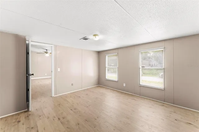 a view of an empty room with a window