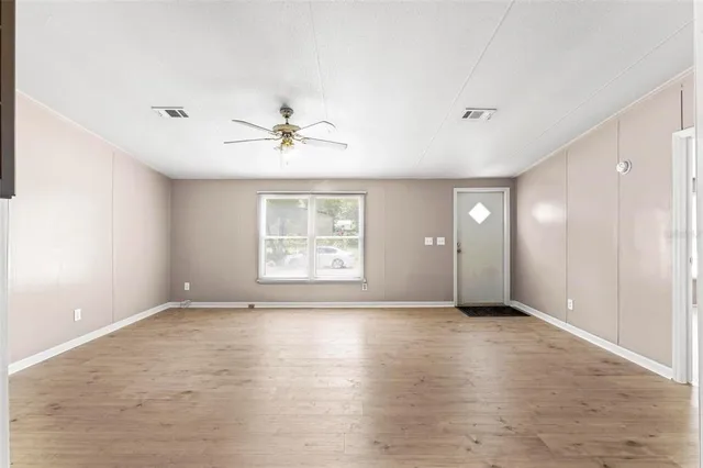 a view of an empty room with a window