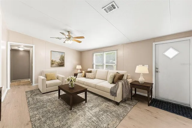 a living room with furniture and a window