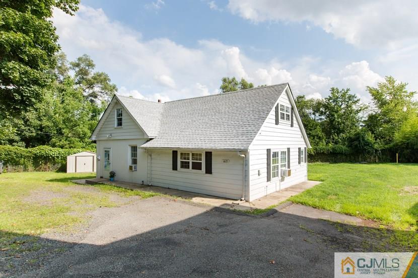 613 Old Post Road Edison, NJ 08817 - Photo 2 of 20 a view of a house with a yard