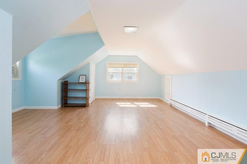 613 Old Post Road Edison, NJ 08817 - Photo 12 of 20 an empty room with wooden floor and windows