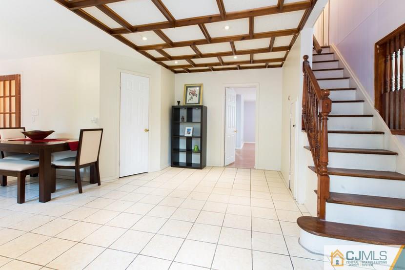 613 Old Post Road Edison, NJ 08817 - Photo 4 of 20 a view of entryway with a dining table and chairs