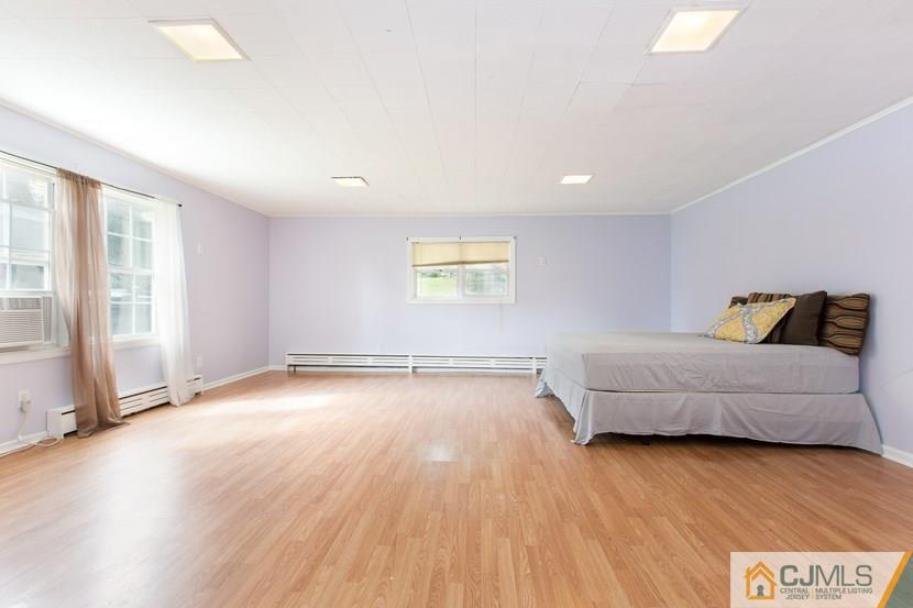 613 Old Post Road Edison, NJ 08817 - Photo 7 of 20 a view of livingroom with furniture and wooden floor