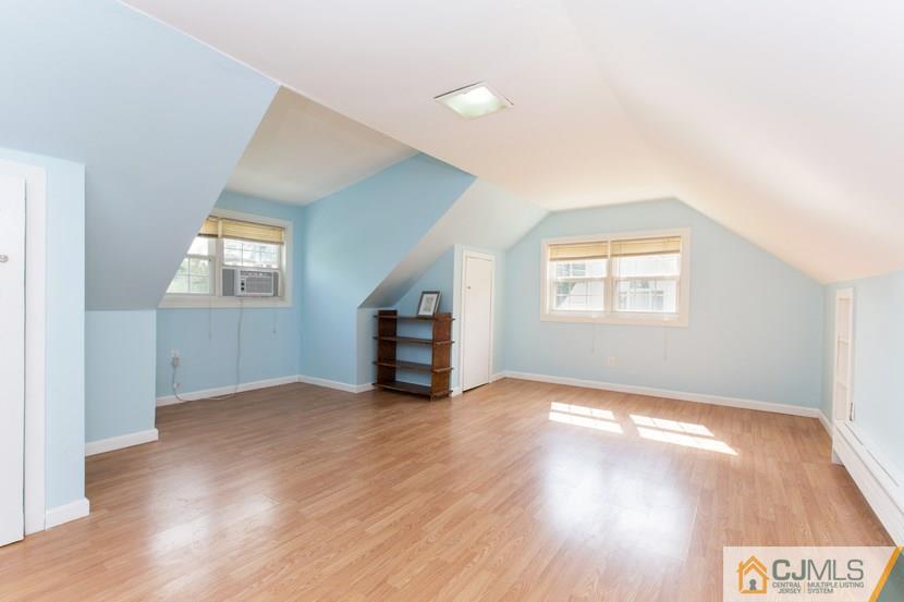 613 Old Post Road Edison, NJ 08817 - Photo 9 of 20 an empty room with windows and entrance