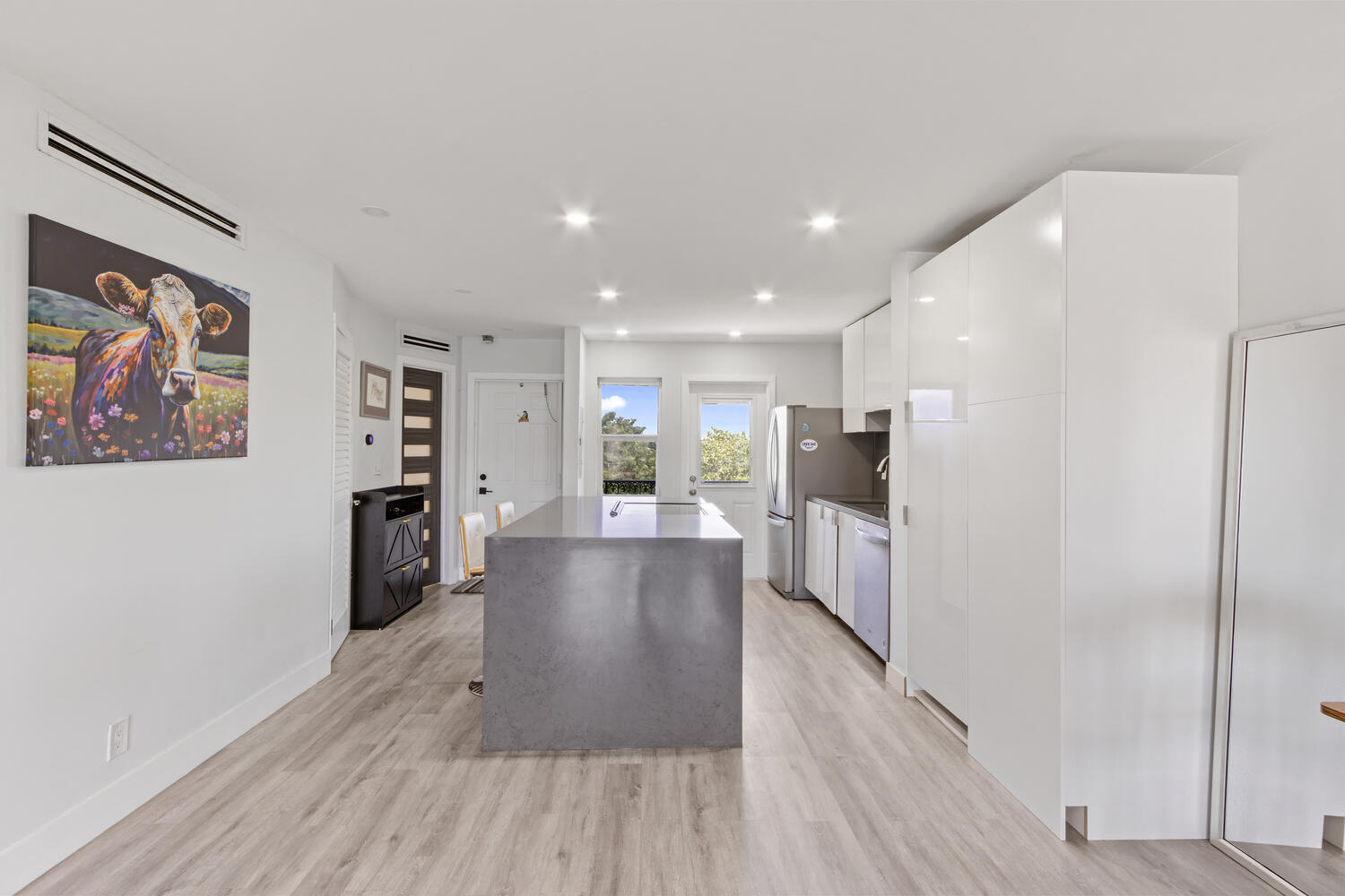 2871 North Ocean Boulevard, Unit V443 Boca Raton, FL 33431 - Photo 13 of 49 a view of a kitchen with furniture and wooden floor