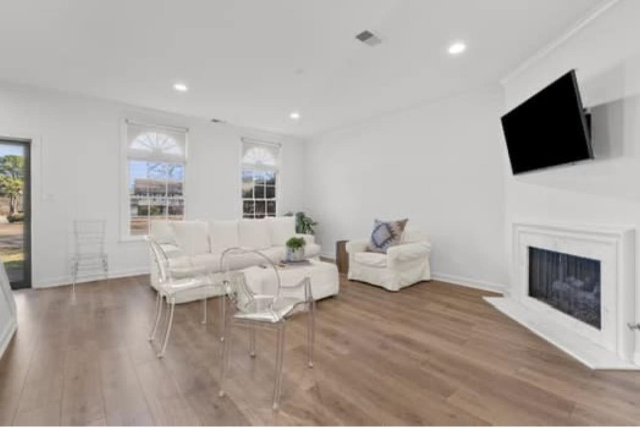 1687 Kimbrough Road, Unit 1687 Germantown, TN 38138 - Photo 8 of 19 Living room featuring a fireplace, wood finished floors, and recessed lighting