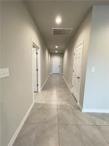 a kitchen with stainless steel appliances a sink a stove a microwave and cabinets