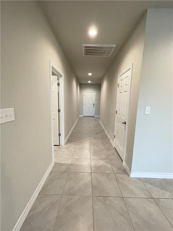 5989 Malta Circle Round Rock, TX 78665 - Photo 4 of 36 Hallway with baseboards and recessed lighting